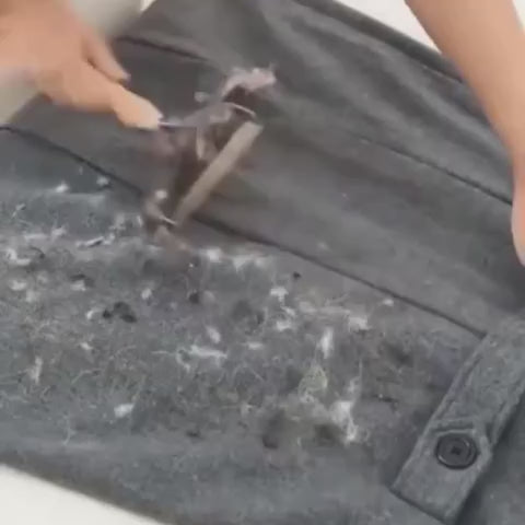 Lifting hair off a dark jacket in a few strokes