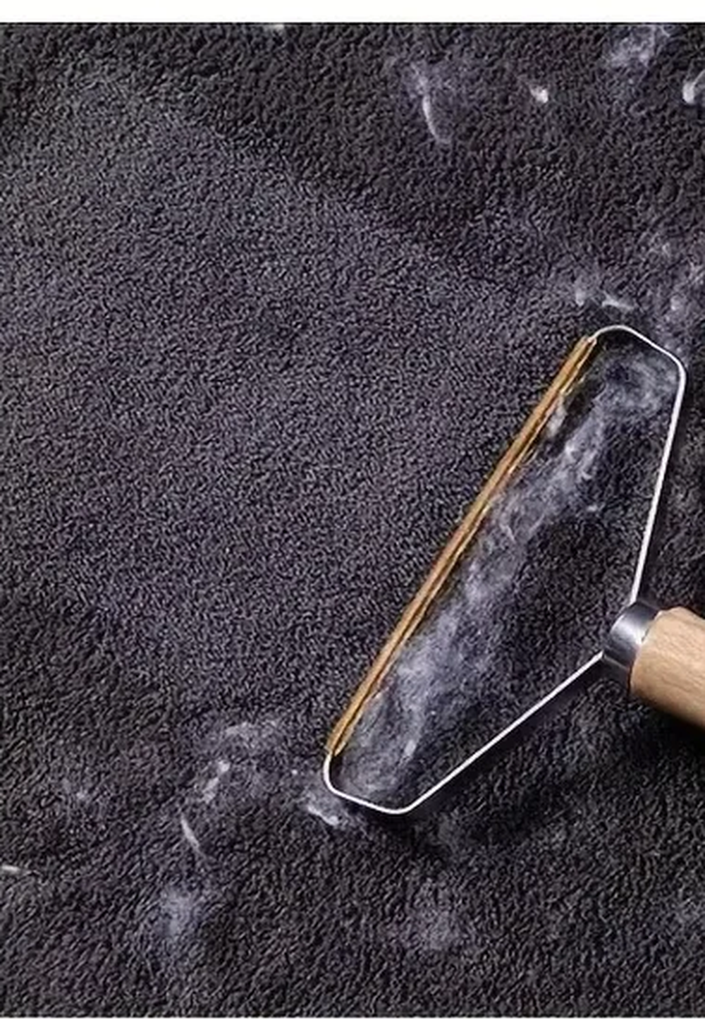 The same carpet with a clean band lifted by the scraper